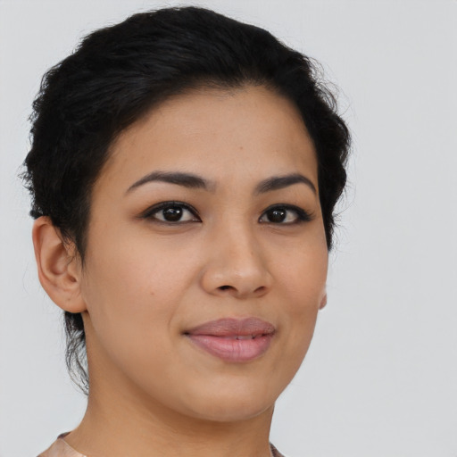 Joyful asian young-adult female with short  black hair and brown eyes