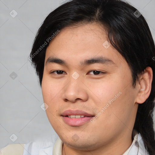 Joyful asian young-adult male with short  brown hair and brown eyes