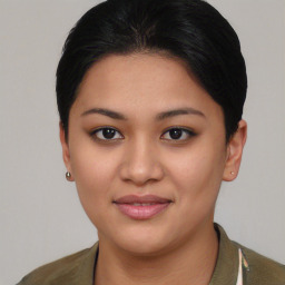 Joyful asian young-adult female with short  black hair and brown eyes