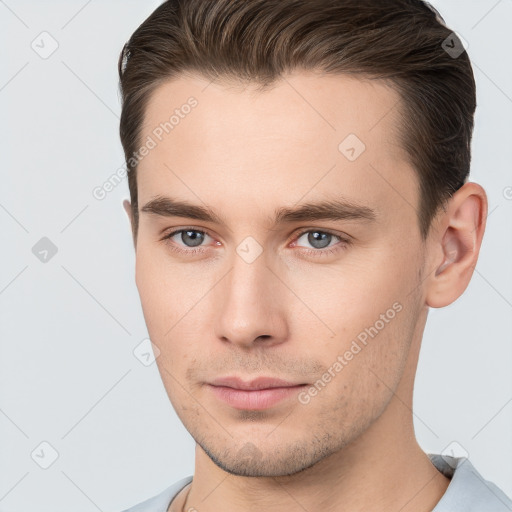 Neutral white young-adult male with short  brown hair and brown eyes