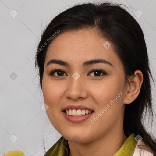 Joyful latino young-adult female with medium  brown hair and brown eyes