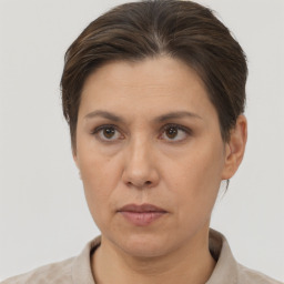 Neutral white adult female with short  brown hair and brown eyes