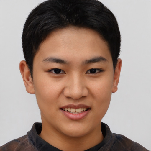 Joyful asian young-adult female with short  black hair and brown eyes