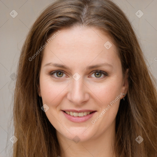 Joyful white young-adult female with long  brown hair and green eyes