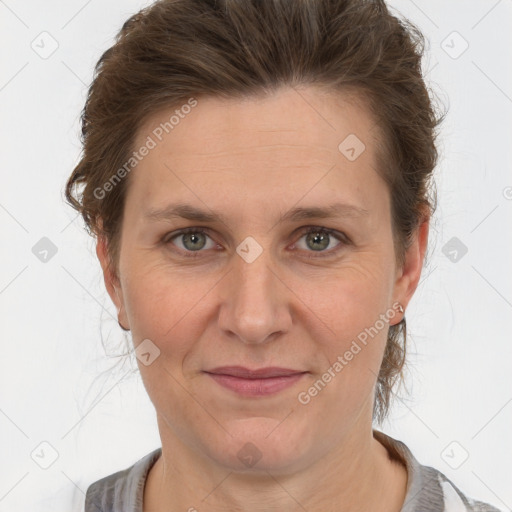 Joyful white adult female with short  brown hair and grey eyes