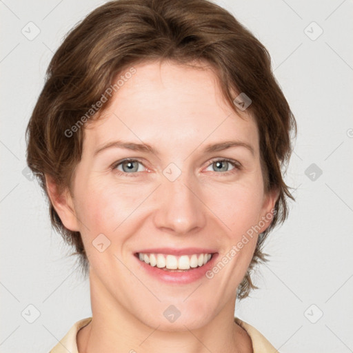 Joyful white young-adult female with medium  brown hair and blue eyes