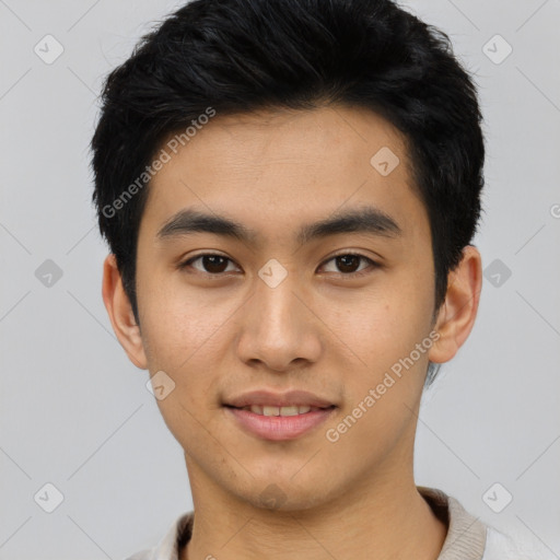 Joyful asian young-adult male with short  black hair and brown eyes