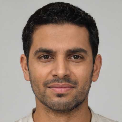 Neutral latino young-adult male with short  black hair and brown eyes