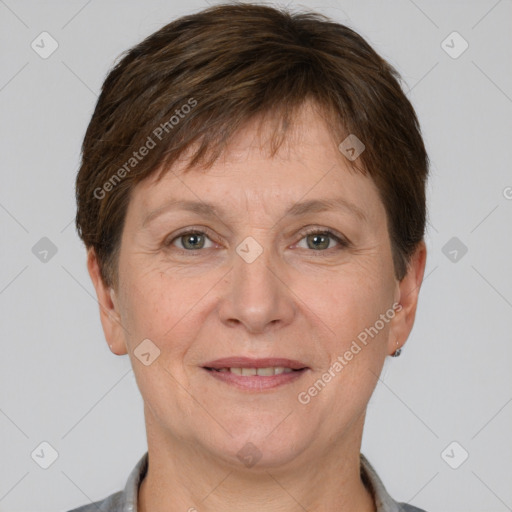 Joyful white adult female with short  brown hair and grey eyes