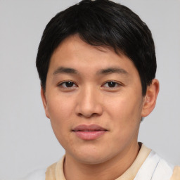 Joyful asian young-adult male with short  black hair and brown eyes