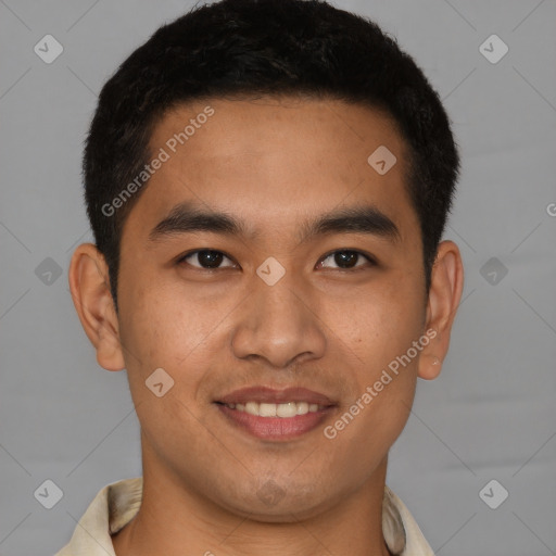 Joyful latino young-adult male with short  brown hair and brown eyes