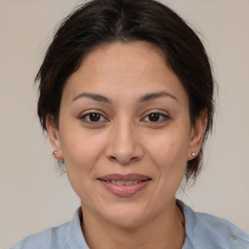 Joyful white adult female with medium  brown hair and brown eyes