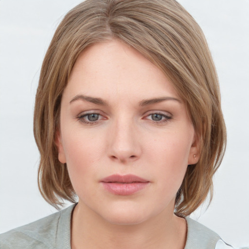 Neutral white young-adult female with medium  brown hair and grey eyes