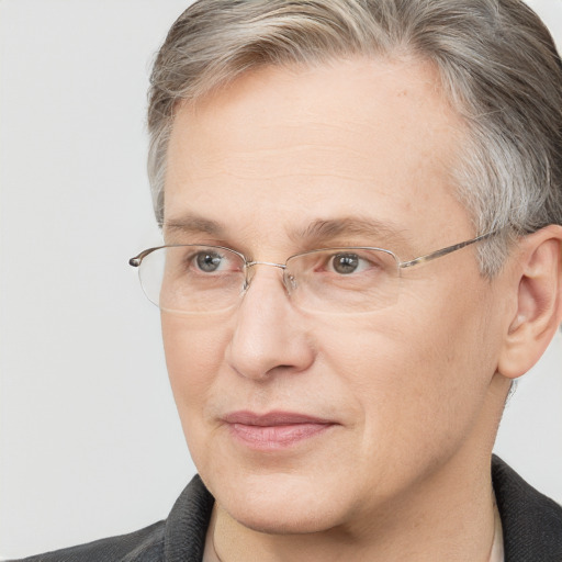 Joyful white adult male with short  brown hair and blue eyes