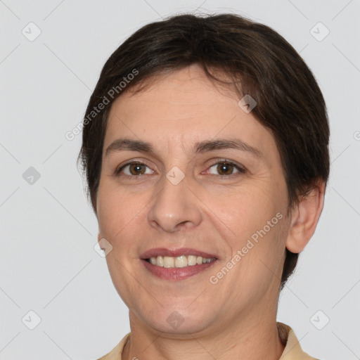 Joyful white adult female with short  brown hair and brown eyes