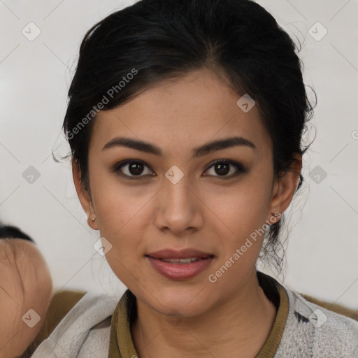 Joyful latino young-adult female with short  black hair and brown eyes