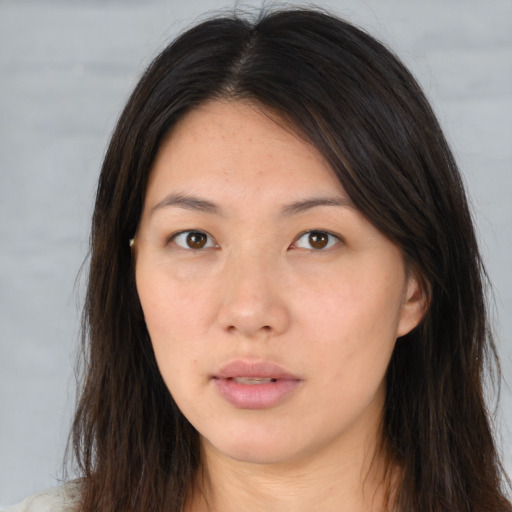 Neutral asian young-adult female with long  brown hair and brown eyes