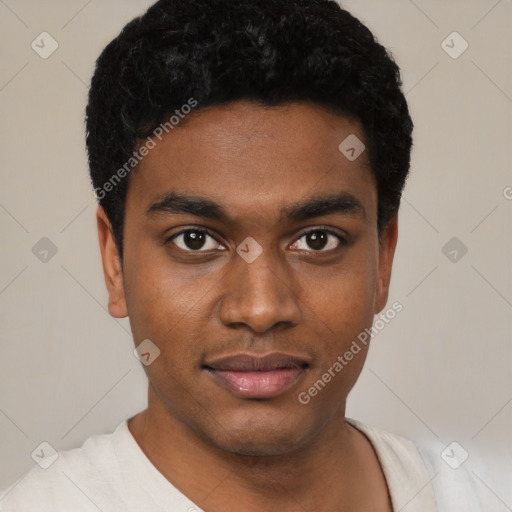 Joyful black young-adult male with short  black hair and brown eyes