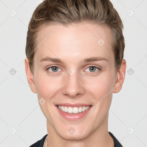 Joyful white young-adult female with short  brown hair and grey eyes