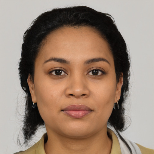 Neutral latino young-adult female with medium  black hair and brown eyes