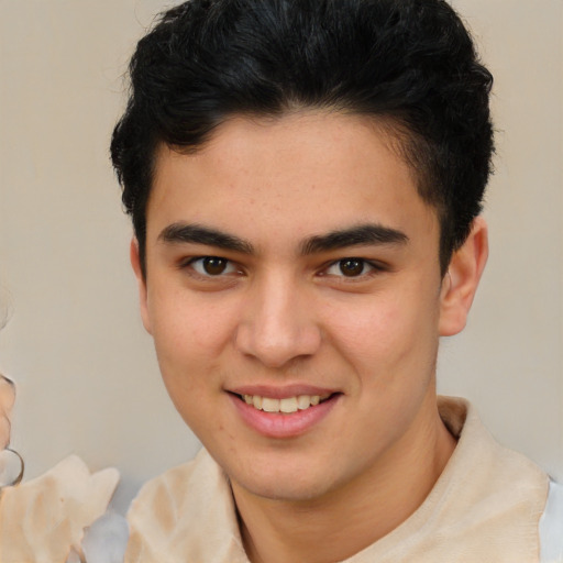 Joyful latino young-adult male with short  brown hair and brown eyes