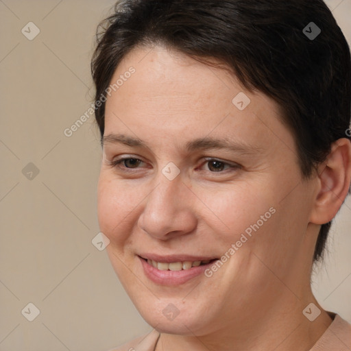 Joyful white adult female with short  brown hair and brown eyes