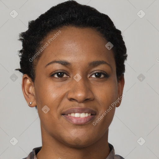 Joyful black young-adult female with short  black hair and brown eyes