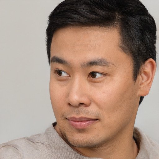 Neutral asian young-adult male with short  black hair and brown eyes