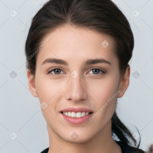 Joyful white young-adult female with medium  brown hair and brown eyes