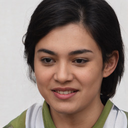 Joyful asian young-adult female with medium  brown hair and brown eyes