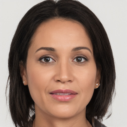 Joyful white adult female with medium  brown hair and brown eyes