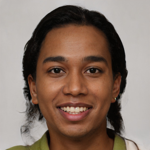 Joyful latino young-adult male with medium  black hair and brown eyes