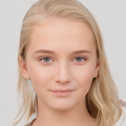 Joyful white child female with medium  brown hair and blue eyes