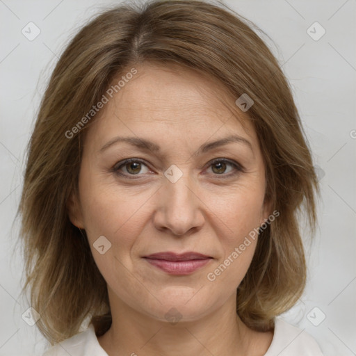 Joyful white adult female with medium  brown hair and brown eyes