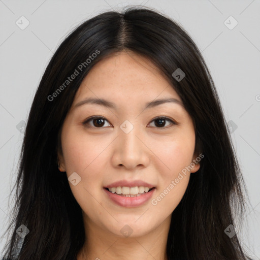 Joyful asian young-adult female with long  brown hair and brown eyes