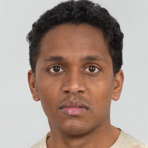 Neutral black young-adult male with short  brown hair and brown eyes