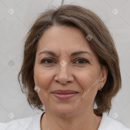 Joyful white adult female with medium  brown hair and brown eyes