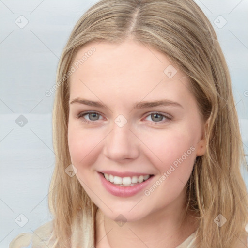 Joyful white young-adult female with long  brown hair and blue eyes