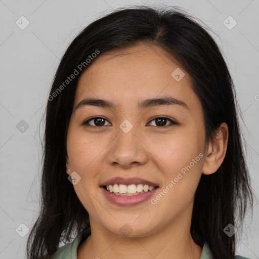 Joyful asian young-adult female with long  brown hair and brown eyes