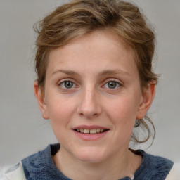 Joyful white young-adult female with medium  brown hair and blue eyes