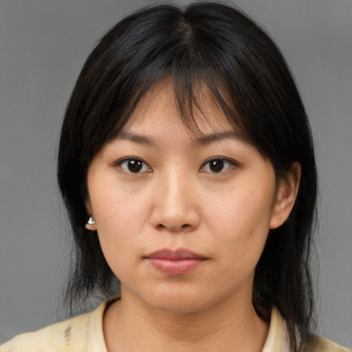 Neutral asian young-adult female with medium  brown hair and brown eyes