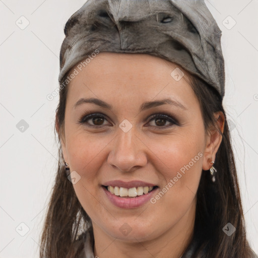 Joyful white adult female with long  brown hair and brown eyes