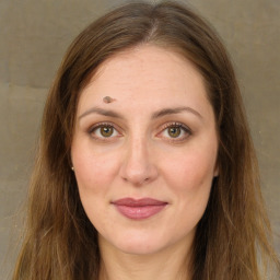 Joyful white young-adult female with long  brown hair and green eyes