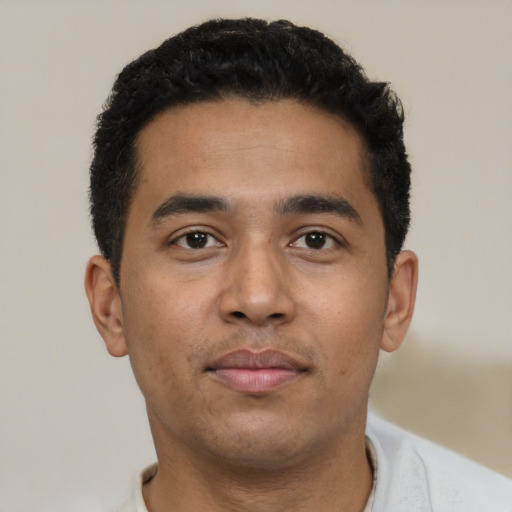 Neutral latino young-adult male with short  black hair and brown eyes