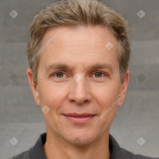 Joyful white adult male with short  brown hair and grey eyes