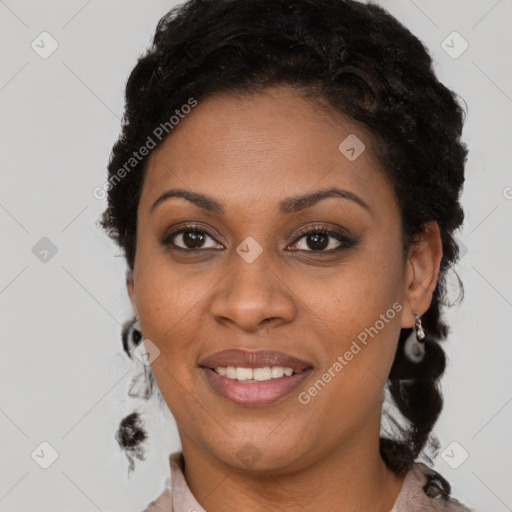 Joyful black adult female with short  brown hair and brown eyes