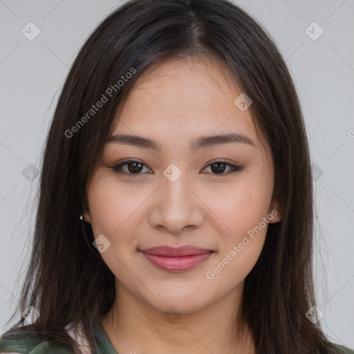 Joyful asian young-adult female with long  brown hair and brown eyes