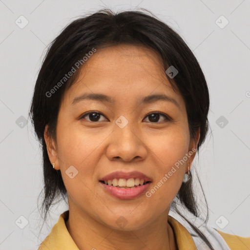 Joyful asian adult female with medium  brown hair and brown eyes