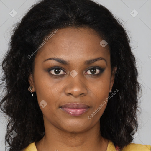 Joyful black young-adult female with long  brown hair and brown eyes