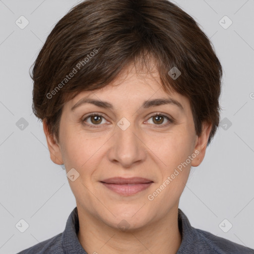 Joyful white adult female with short  brown hair and brown eyes